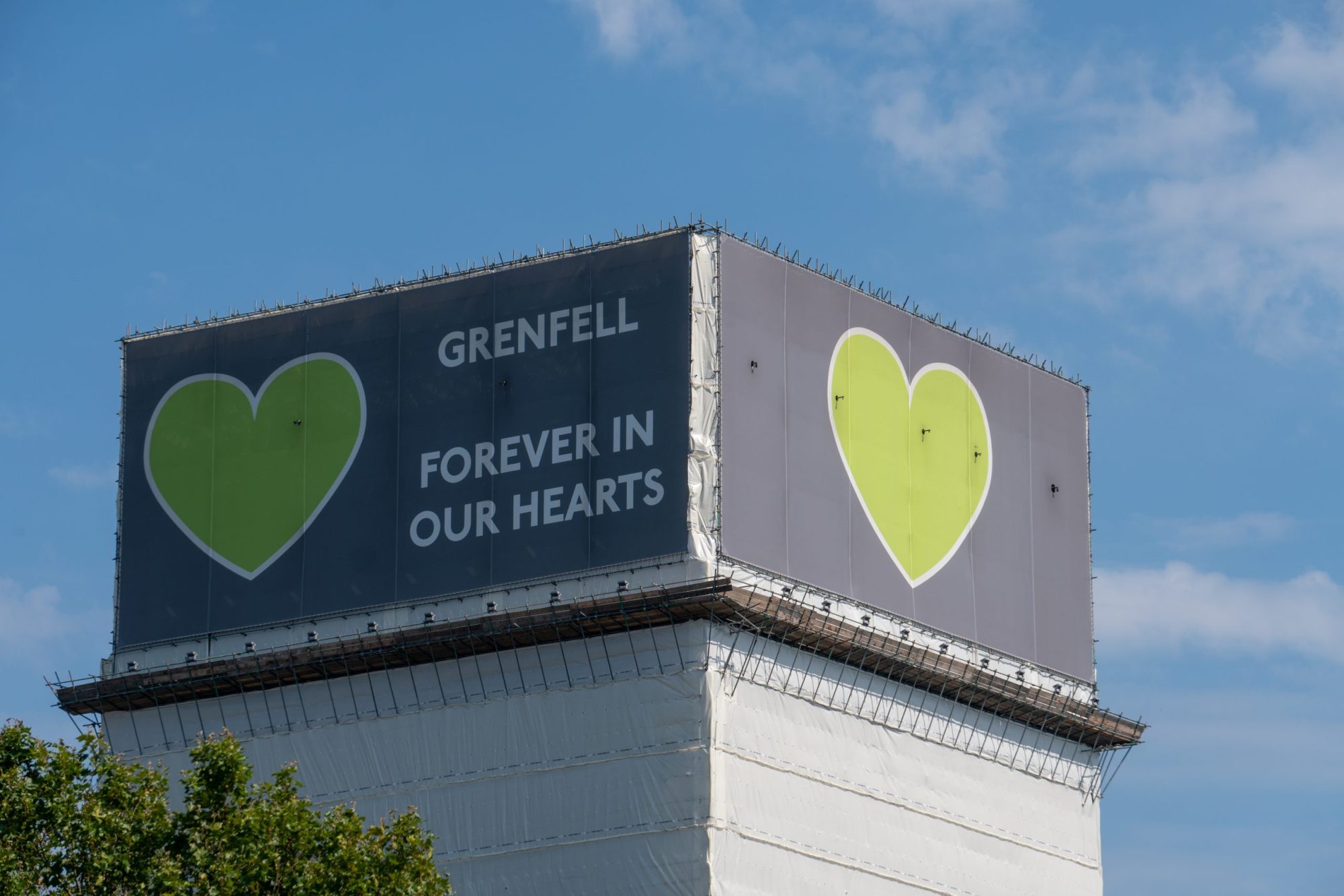 The Grenfell Tower, with a cover reading 'Grenfell: Forever in our Hearts