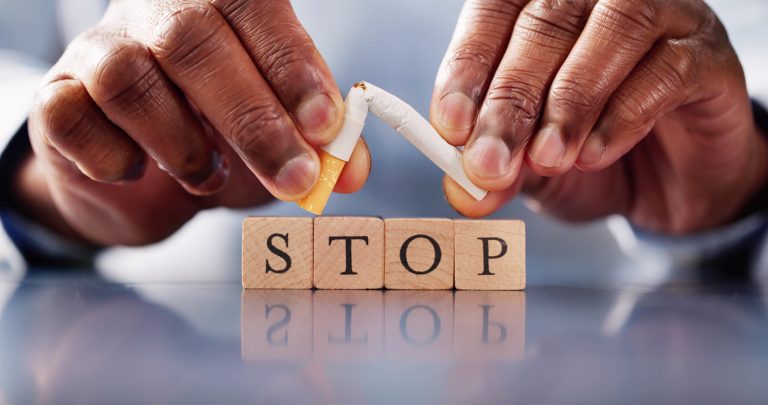 A broken Cigarette, with 'Stop' in front: Smokefree Britain