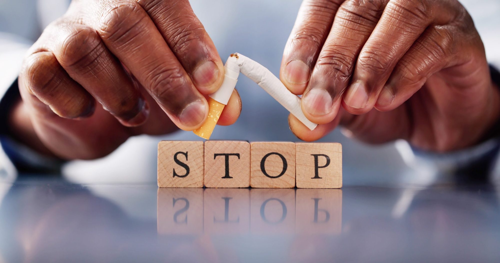 A broken Cigarette, with 'Stop' in front: Smokefree Britain