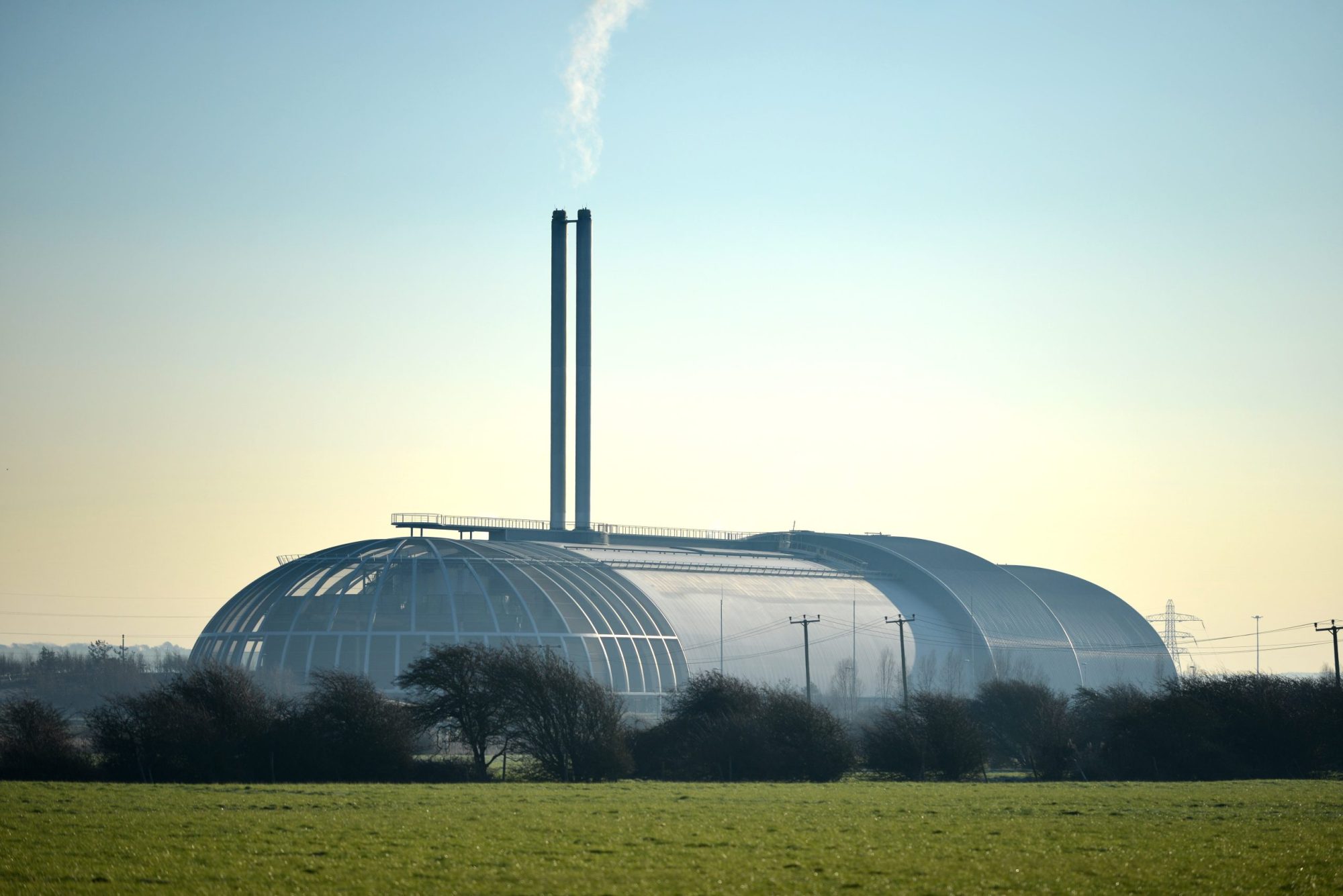 Morning light on Newhaven waste incinerator, East Sussex UK. Household waste from Brighton and nearby areas is processed at Newhaven where it is burned to generate electricity for local homes