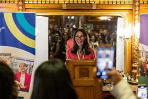 Mindy Simon delivering her International Women's Day speech.