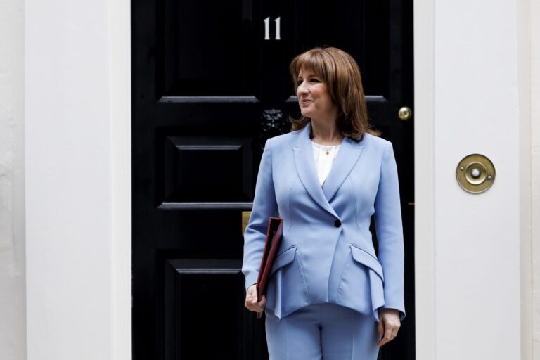 Chancellor Rachel Reeves in light blue suit outside 11 Downing Street before the Spring Statement