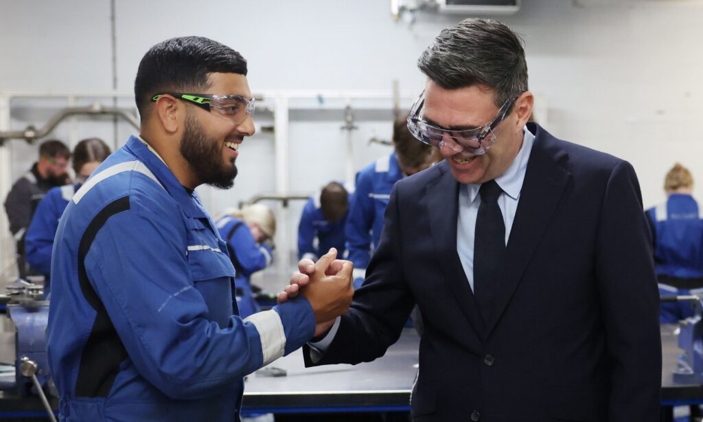 Prime Minister, Andy Burnham and Wes Streeting, Secretary of State for Defence visit a workshop at BAE Systems at the nuclear submarine base in Barrow. (Photo: Lauren Hurley/No 10 Downing Street)